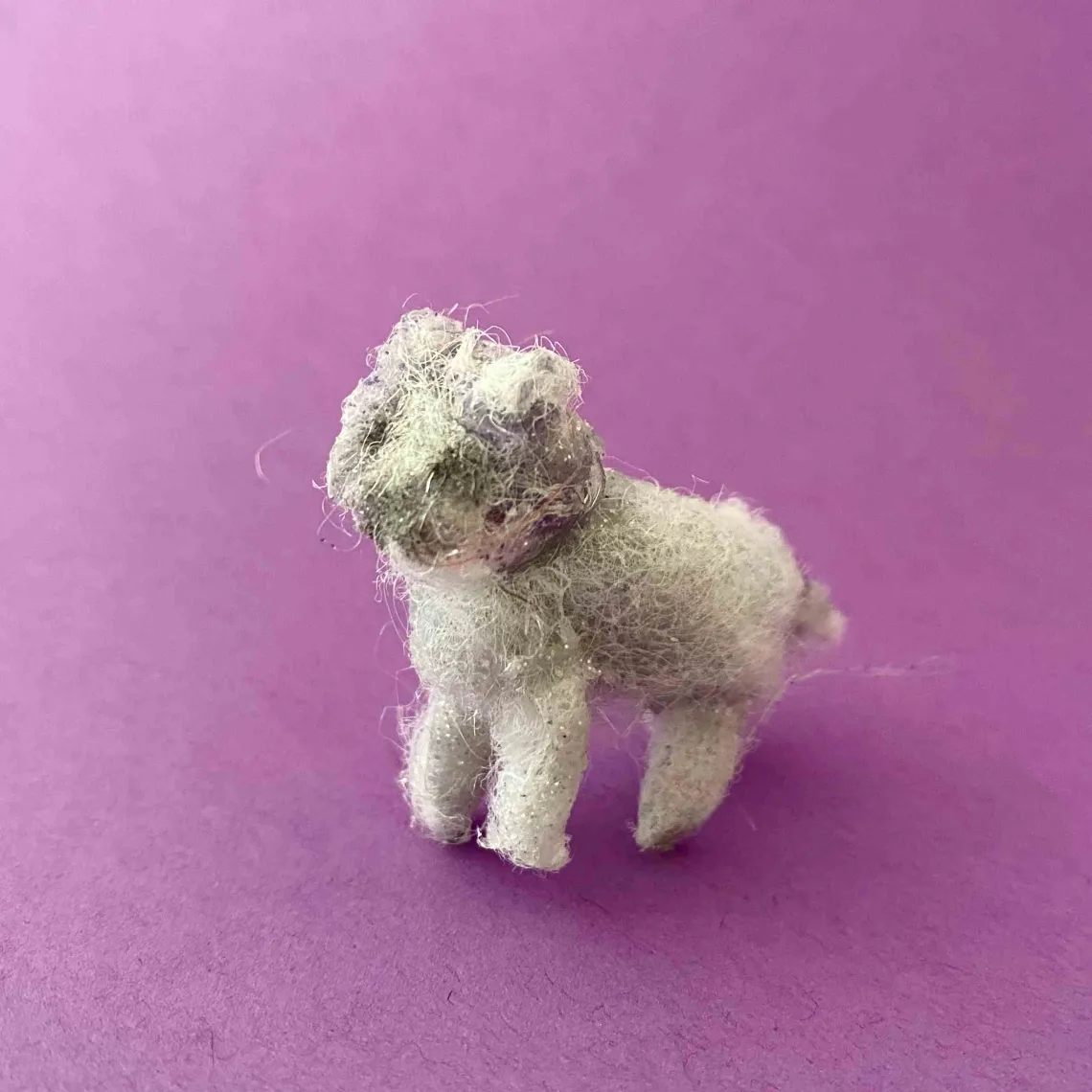 white animal on purple background